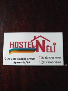 阿帕雷西达Hostel Néli的一张有标志的房子的票