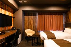 Hotel Wing International Select Kumamoto客房内的一张或多张床位