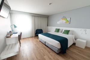 Ilha Hostel & Suites客房内的一张或多张床位