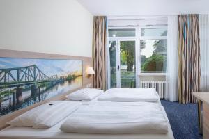格鲁内瓦尔德景观酒店客房内的一张或多张床位