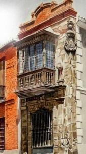 雷阿尔城Casa palacio El Conde de la Cańada的一侧带阳台的建筑