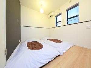 东京古都涩谷3公寓客房内的一张或多张床位