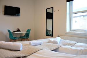 Hotel Nuka客房内的一张或多张床位