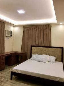 Arcadio's Guest House in Mactan, Cebu客房内的一张或多张床位
