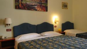 阿尔塔维拉德西酒店客房内的一张或多张床位