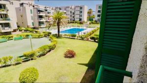 美洲海滩Viñas by Villas Rinamar的带游泳池的庭院公寓