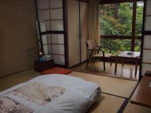 石场日式旅馆 客房内的一张或多张床位