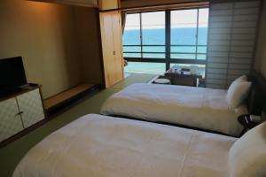 HOTEL&RESORT Izu no Ne客房内的一张或多张床位