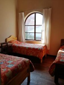 Casa Treveris - Non profit Hostel客房内的一张或多张床位