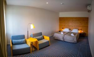 卡萨里度假中心酒店客房内的一张或多张床位