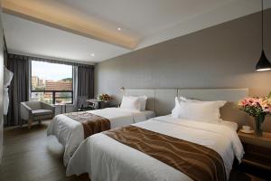 汉永·瑞酒店（深圳机场店）客房内的一张或多张床位