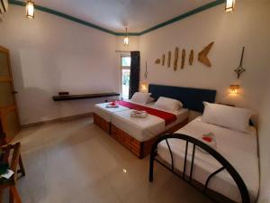 Dream Inn Sun Beach Hotel Maldives客房内的一张或多张床位