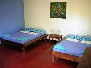 Hospedaje Soma Ometepe Hotel客房内的一张或多张床位