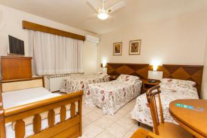 Tri Hotel Lago Gramado客房内的一张或多张床位
