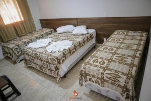 Pousada Encantos da Serra客房内的一张或多张床位