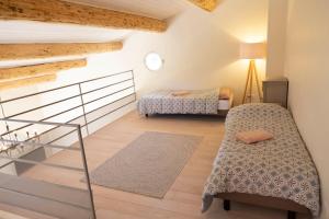 Le Panorama des Alpilles客房内的一张或多张床位