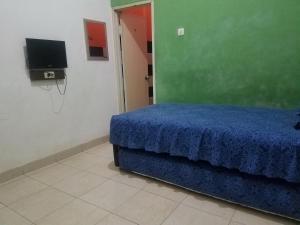 Cendrawasih Syariah Homestay客房内的一张或多张床位