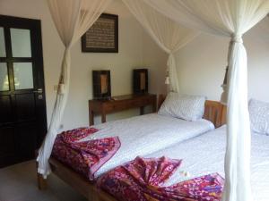 Villa Mangga at Bali Beach客房内的一张或多张床位