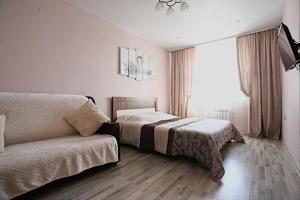 Апартаменты на Байкальской客房内的一张或多张床位
