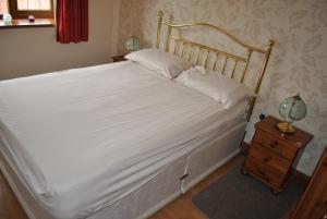 Oldcotes Cottages客房内的一张或多张床位
