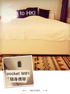 赫尔辛基SUPER easy to airport/HKI , full aptment max 4ppl的一张床的照片,旁边还有一本书