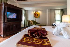 Seaview Resort Khao Lak - SHA Plus客房内的一张或多张床位