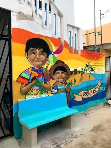 奥尔沃克斯岛Estudios Rehilete的一张坐在长凳上的两名儿童的壁画