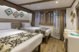 SUNRISE Mahrousa Cruise客房内的一张或多张床位