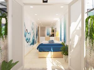 河内Graffiti Hotel的一间白色客房内的蓝色床卧室