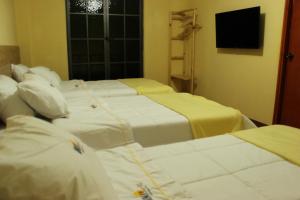 Hotel NUMAY客房内的一张或多张床位