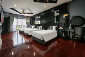 Vientiane Boutique Hotel客房内的一张或多张床位