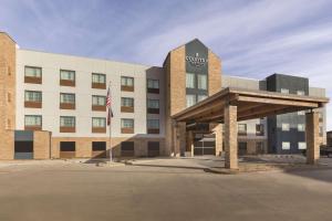 拉伯克Country Inn & Suites by Radisson, Lubbock Southwest, TX的酒店前方的 ⁇ 染