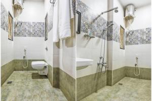 蓬蒂切里FabExpress Santhi Inn, Promenade Beach的浴室配有卫生间、盥洗盆和淋浴。