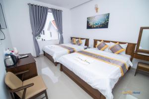 Côn Sơn Victory Hotel客房内的一张或多张床位