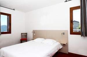 维卡西奥利伊萨德小屋公寓式酒店客房内的一张或多张床位
