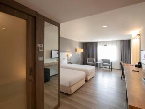 Fortune View Khong Hotel Nakhon Phanom客房内的一张或多张床位