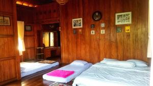 Oemah Kajoe Lembang客房内的一张或多张床位