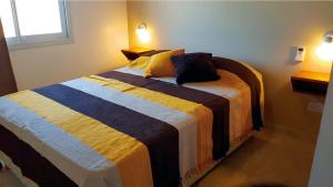 Apartamentos Barranca de Termas客房内的一张或多张床位