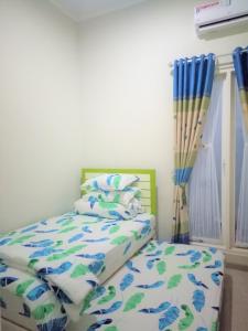 Alysahouse - 2 Bedrooms, Dekat JTP3客房内的一张或多张床位