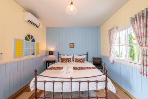 Baan Kang Hun Pua Cottage客房内的一张或多张床位