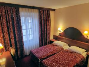 Hotel Amalia客房内的一张或多张床位