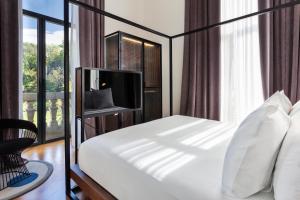 一期一会塔巴卡莱拉酒店客房内的一张或多张床位