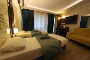 Rest Inn Aydın Hotel客房内的一张或多张床位