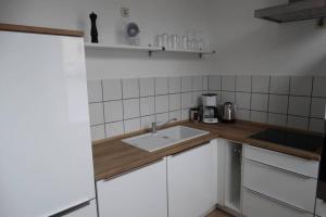Qonroom - as individual as you - Oeynhausen City的厨房或小厨房