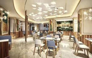 广州广州新华大酒店的餐厅内带桌椅的用餐室