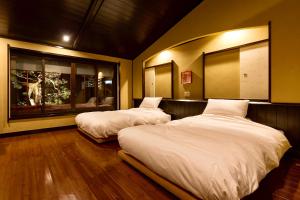 坎普顿度假屋 京都西阵客房内的一张或多张床位