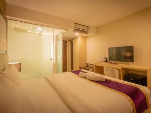 Royce Hotel Kuala Lumpur Sentral客房内的一张或多张床位
