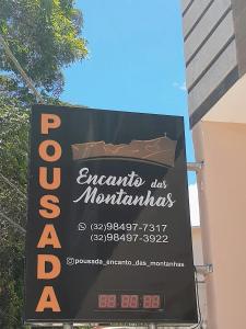 Caparaó VelhoPousada Encanto das Montanhas的大楼一侧餐厅标志