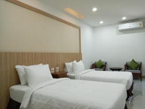 Nine Smiths Hotel Chiangmai客房内的一张或多张床位