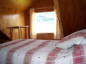 Lodge de Montaña Lago Monreal客房内的一张或多张床位